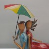Couple Métal Assis sous un Parapluie