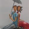 Couple Métal Assis sous un Parapluie
